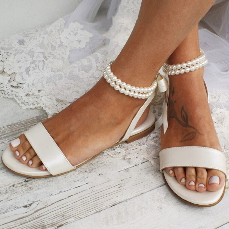 ヨーロッパとアメリカの新しい夏の女性のフラットサンダルパール - Leather Classic Strap のレビューと価格